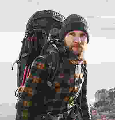 A man with backpack hiking in the wilderness of Colombia