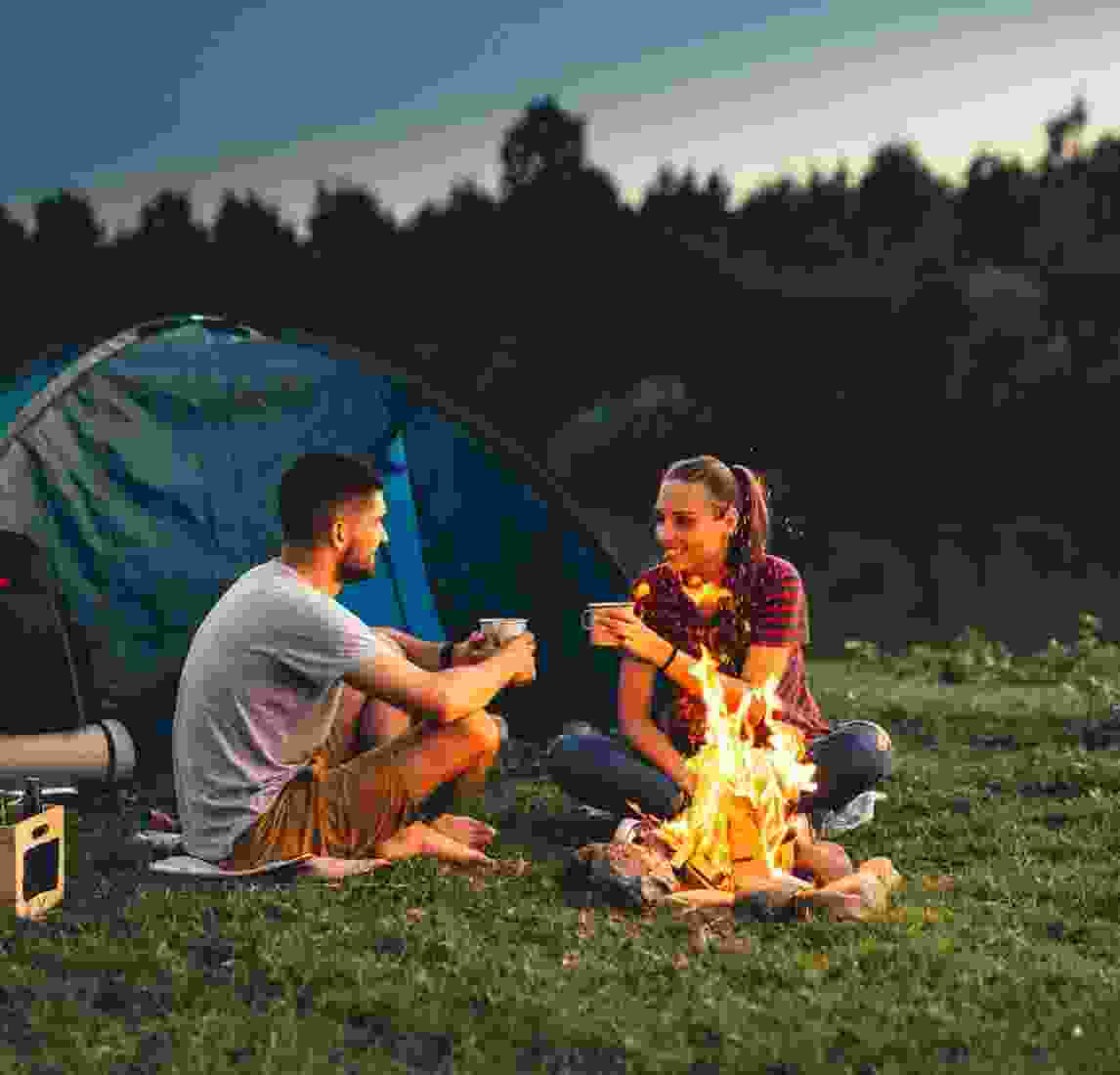 An excited camping couple recounts their fun-filled day hiking in the forest.