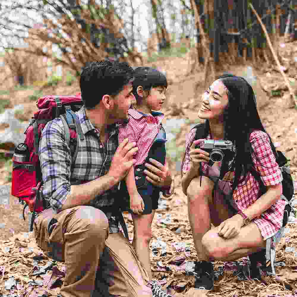 A family hiking and vacationing and taking photos.