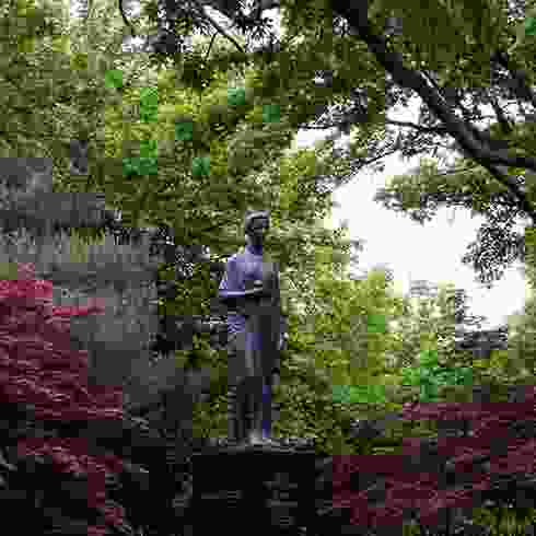 A religious or national statue surrounded by natural splendor.