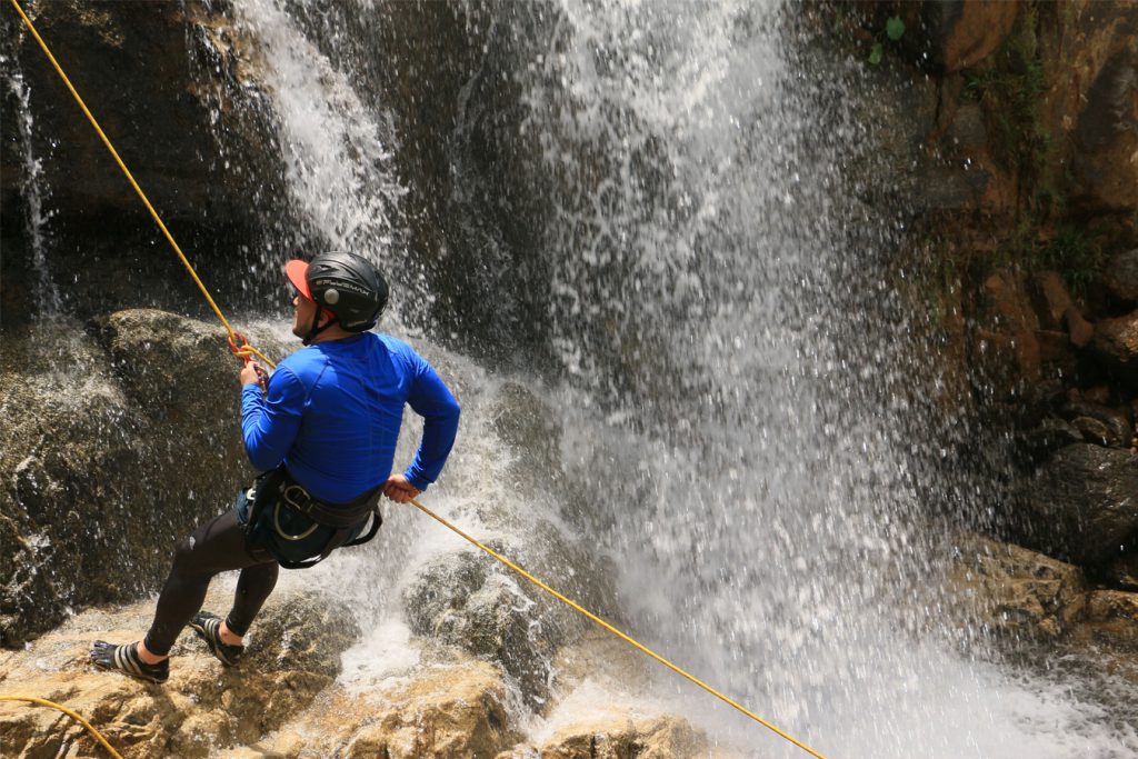 Trekking to a secluded waterfall in the Colombian jungle.